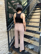 Embrace the whimsical charm of the Charlie Light Coco Pleated Pants! With a playful paper bag waist and a fashionable wide leg design, these pants are perfect for twirling into fall adventures. The adjustable drawstring ensures a comfortable fit, while the delightful stretchy fabric lets you lounge or dance with ease. 

- Playful pleated paper bag waist for a chic look 
- Comfortable stretchy fabric for all-day wear 
- Stylish wide leg silhouette for a flirty flair 
- Easy to care for: machine wash cold, li