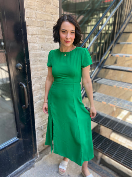 Step out in style with the Harper Kelly Green Side Slit Midi Dress. This stunning dress combines elegance with a touch of daring, featuring a chic side slit that enhances your silhouette. Perfect for any occasion, from brunch dates to evening events, you'll feel effortlessly confident and stylish. 

- Eye-catching kelly green colour 
- Flattering midi length 
- Elegant side slit design 
- Versatile for day or night 
- Comfortable fit for all-day wear 
- Ideal for layering with jackets or accessories 