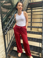 Step into style and comfort with the Jodie Red Ribbed Drawstring Pants. These pants are effortlessly chic and perfect for any occasion. With an elastic waist for a custom fit and a flattering wide-leg silhouette, you’ll feel fabulous every time you wear them. Plus, the convenient pockets ensure your essentials are always within reach.

- Elastic waist for ultimate comfort
- Flattering wide-leg design
- Handy pockets for your essentials
- Soft ribbed fabric for a luxurious feel
- Care: Hand wash cold and lin