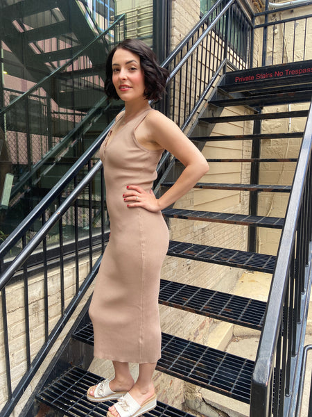 Introducing the Marlowe Taupe Ribbed Midi Dress, your new go-to for effortless style. This dress combines comfort and sophistication, featuring a flattering ribbed fabric that hugs your curves in all the right places. Dress it up with heels for a night out or keep it casual with sneakers—it's versatile enough for any occasion. 

- Flattering midi length 
- Soft ribbed texture for ultimate comfort 
- Perfect for layering or wearing alone 
- Easy to style for any event 