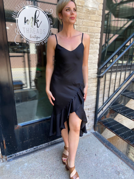 Step out in style with the Briella Black Ruffle Trim Midi Dress. This elegant black dress perfectly combines sophistication with charm. Its ruffle trims add a playful twist, making it ideal for both casual outings and special occasions. 

- Flattering midi length 
- Chic ruffle detailing 
- Versatile for various events 
- Made from high-quality materials 