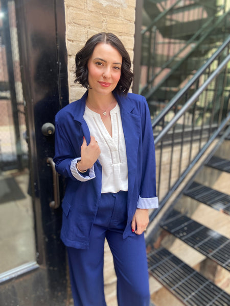 Step into sophistication with the Freya Navy Blue Linen Blazer. Perfect for both work and leisure, this blazer seamlessly elevates any outfit. Its breathable linen fabric ensures comfort, while the tailored fit flatters every figure. 

- Stylish navy blue colour complements various outfits 
- Lightweight and breathable for year-round wear 
- Versatile design ideal for both casual and formal occasions 
- Easy to pair with trousers or dresses for a chic look 
- Machine washable for effortless care 