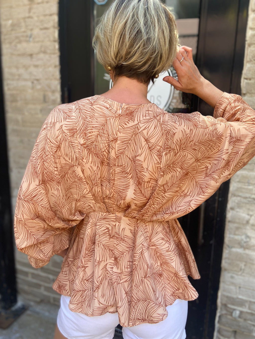 Saige Peach Tropical Peplum Top