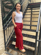 Step into style and comfort with the Jodie Red Ribbed Drawstring Pants. These pants are effortlessly chic and perfect for any occasion. With an elastic waist for a custom fit and a flattering wide-leg silhouette, you’ll feel fabulous every time you wear them. Plus, the convenient pockets ensure your essentials are always within reach.

- Elastic waist for ultimate comfort
- Flattering wide-leg design
- Handy pockets for your essentials
- Soft ribbed fabric for a luxurious feel
- Care: Hand wash cold and lin