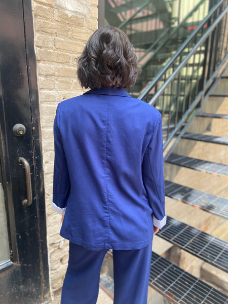 Step into sophistication with the Freya Navy Blue Linen Blazer. Perfect for both work and leisure, this blazer seamlessly elevates any outfit. Its breathable linen fabric ensures comfort, while the tailored fit flatters every figure. 

- Stylish navy blue colour complements various outfits 
- Lightweight and breathable for year-round wear 
- Versatile design ideal for both casual and formal occasions 
- Easy to pair with trousers or dresses for a chic look 
- Machine washable for effortless care 
