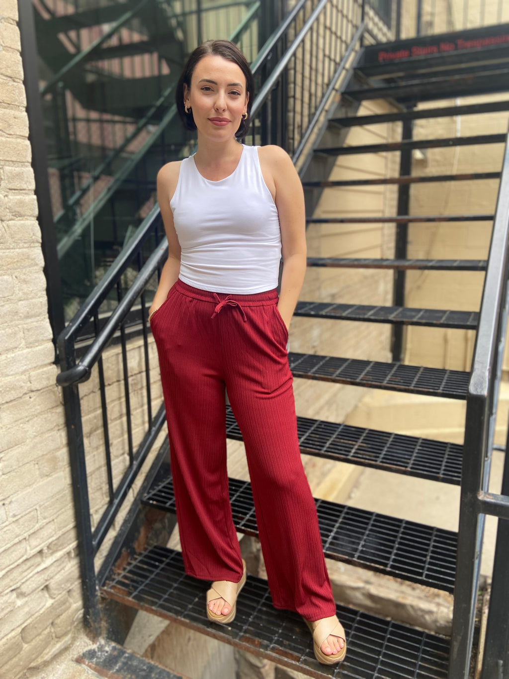 Step into style and comfort with the Jodie Red Ribbed Drawstring Pants. These pants are effortlessly chic and perfect for any occasion. With an elastic waist for a custom fit and a flattering wide-leg silhouette, you’ll feel fabulous every time you wear them. Plus, the convenient pockets ensure your essentials are always within reach.

- Elastic waist for ultimate comfort
- Flattering wide-leg design
- Handy pockets for your essentials
- Soft ribbed fabric for a luxurious feel
- Care: Hand wash cold and lin