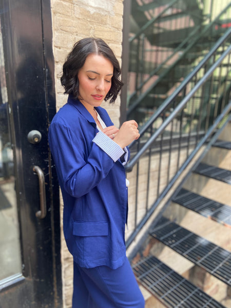 Step into sophistication with the Freya Navy Blue Linen Blazer. Perfect for both work and leisure, this blazer seamlessly elevates any outfit. Its breathable linen fabric ensures comfort, while the tailored fit flatters every figure. 

- Stylish navy blue colour complements various outfits 
- Lightweight and breathable for year-round wear 
- Versatile design ideal for both casual and formal occasions 
- Easy to pair with trousers or dresses for a chic look 
- Machine washable for effortless care 