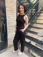 Step into effortless style with the Alice Black Crepe High Waist Pants. Designed for both comfort and chicness, these pants feature a flattering straight leg and a stylish self-tie belt, perfect for showcasing your fashion sense. 

- High waist with a self-tie belt for a customised fit 
- Textured knit crepe for added style 
- Convenient pockets for practicality 
- Relaxed straight fit for all-day comfort 
- Elastic back waistband for ease of movement 
