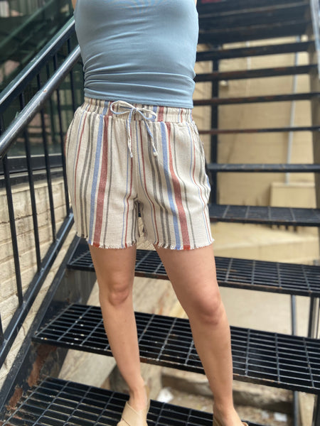 Meet your new summer favourite: the Eden Striped Linen Shorts. Designed for those sunny, laid-back days, these shorts offer a comfy drawstring waist and vibrant stripes that effortlessly elevate your casual look. Ideal for lounging or exploring, they embody that relaxed vibe you crave.

- Elastic waistband with front tie for adjustable fit
- Functional side pockets for added convenience
- Made from breathable 52% linen and 48% viscose
- Lightweight fabric keeps you cool all day
- Unique novelty wash process