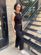 Step into effortless style with the Alice Black Crepe High Waist Pants. Designed for both comfort and chicness, these pants feature a flattering straight leg and a stylish self-tie belt, perfect for showcasing your fashion sense. 

- High waist with a self-tie belt for a customised fit 
- Textured knit crepe for added style 
- Convenient pockets for practicality 
- Relaxed straight fit for all-day comfort 
- Elastic back waistband for ease of movement 
