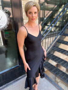 Step out in style with the Briella Black Ruffle Trim Midi Dress. This elegant black dress perfectly combines sophistication with charm. Its ruffle trims add a playful twist, making it ideal for both casual outings and special occasions. 

- Flattering midi length 
- Chic ruffle detailing 
- Versatile for various events 
- Made from high-quality materials 