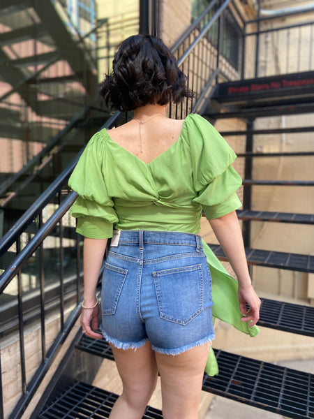 Introducing the Riley Green Reversible Puff Sleeve Top—your new go-to for effortless style. This trendy top features chic puff sleeves and a versatile design that lets you flaunt two looks in one. Whether you’re dressing up for a night out or keeping it casual, this top has got you covered. 

- Reversible design for versatile styling 
- Trendy puff sleeves for a touch of elegance 
- Perfect for any occasion—dress it up or down 
- Comfortable and flattering fit 
- Easy to pair with jeans, skirts, or shorts 