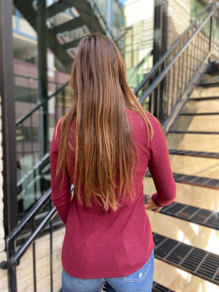 Back view of a wine colored waffle knit top