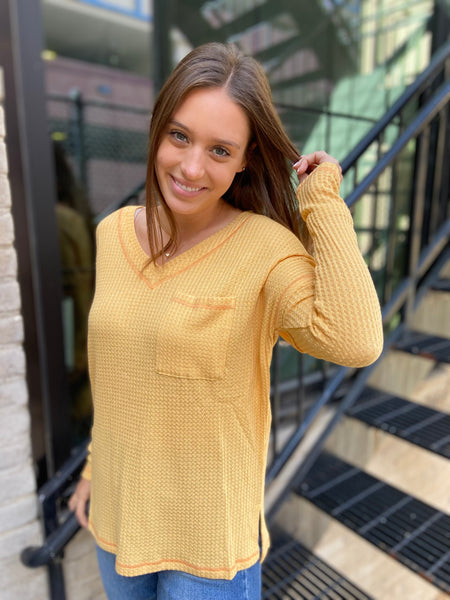 Mustard colored waffle knit v neck top