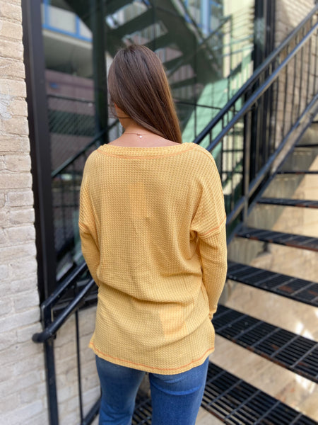 Back View of mustard colored waffle knit top