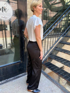 Introducing the Sorrel Black Satin Cargo Pants, your new go-to for a stylish yet functional look. These cargo pants feature sleek satin material that elevates the classic design, making them perfect for any occasion—whether you're heading out with friends or just lounging at home. 

- Trendy cargo pockets for added convenience 
- Soft, luxurious fabric for ultimate comfort 
- Versatile style pairs well with various tops 
- Ideal for day-to-night wear 