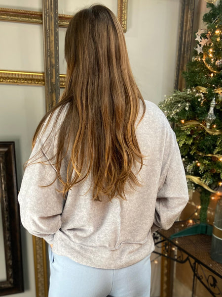 Back view of a Heather gray brushed hacci knit long sleeve top with exposed seams