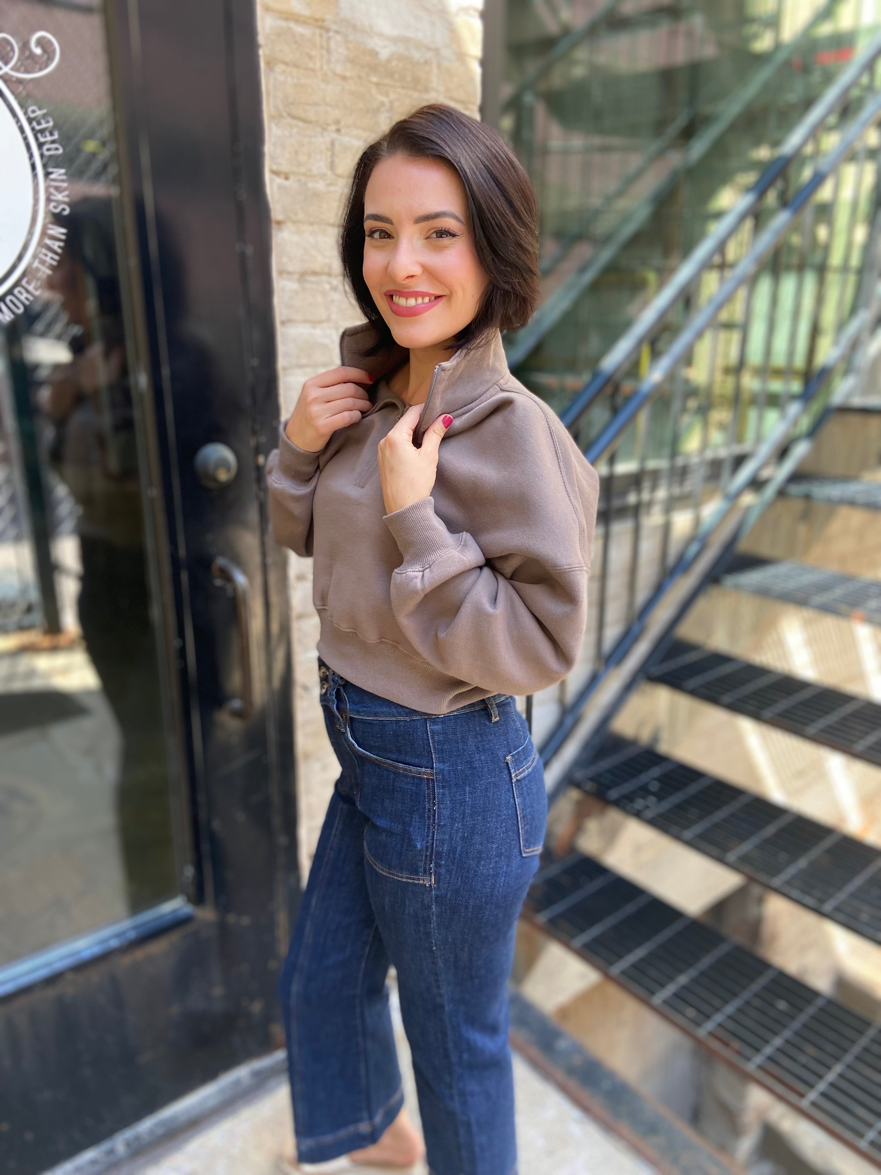 Side view of a mocha colored Cropped Fleece Pullover Sweatshirt with half zip neck