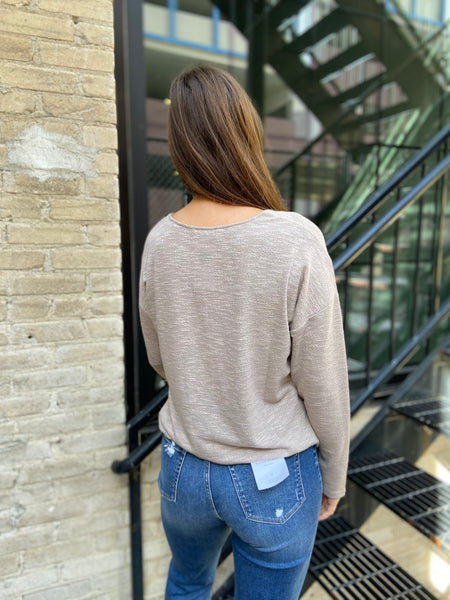 Back view of light mocha loose knit sweater