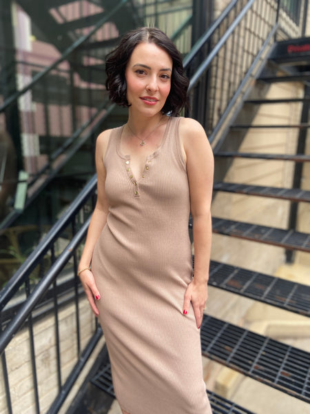 Introducing the Marlowe Taupe Ribbed Midi Dress, your new go-to for effortless style. This dress combines comfort and sophistication, featuring a flattering ribbed fabric that hugs your curves in all the right places. Dress it up with heels for a night out or keep it casual with sneakers—it's versatile enough for any occasion. 

- Flattering midi length 
- Soft ribbed texture for ultimate comfort 
- Perfect for layering or wearing alone 
- Easy to style for any event 