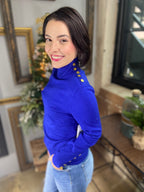 Royal blue sweater with gold buttons
