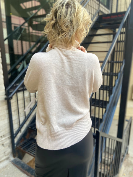 Back view of oatmeal sweater