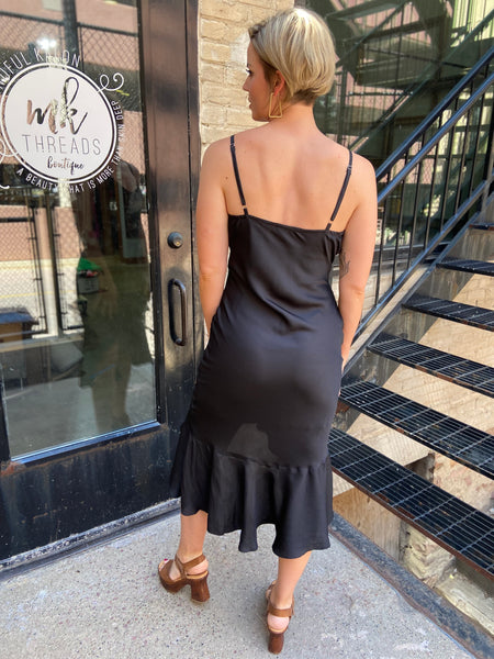 Step out in style with the Briella Black Ruffle Trim Midi Dress. This elegant black dress perfectly combines sophistication with charm. Its ruffle trims add a playful twist, making it ideal for both casual outings and special occasions. 

- Flattering midi length 
- Chic ruffle detailing 
- Versatile for various events 
- Made from high-quality materials 