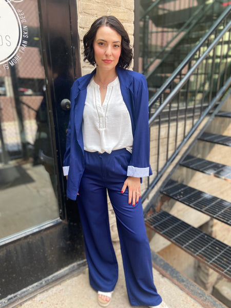 Step into sophistication with the Freya Navy Blue Linen Blazer. Perfect for both work and leisure, this blazer seamlessly elevates any outfit. Its breathable linen fabric ensures comfort, while the tailored fit flatters every figure. 

- Stylish navy blue colour complements various outfits 
- Lightweight and breathable for year-round wear 
- Versatile design ideal for both casual and formal occasions 
- Easy to pair with trousers or dresses for a chic look 
- Machine washable for effortless care 