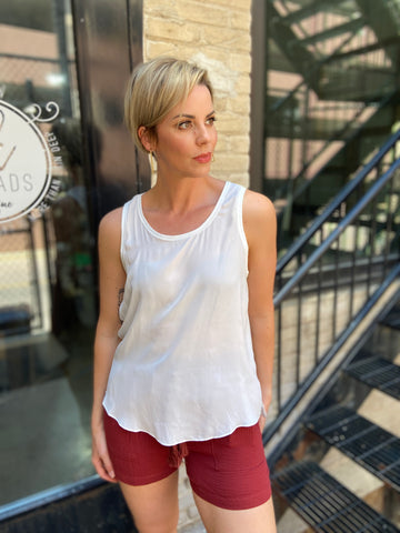 Elevate your wardrobe with the Jovie White Sleeveless Top, the perfect blend of style and comfort. This new, sleeveless design is ideal for warm days or layering under a jacket for a chic look. Its classic white colour makes it a versatile addition to any outfit. 

- Stylish sleeveless design 
- Crisp white colour for easy pairing 
- Lightweight fabric for all-day comfort 
- Perfect for casual or dressy occasions 