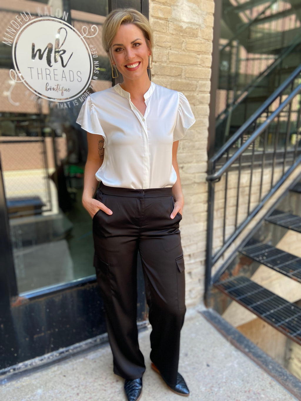 Introducing the Sorrel Black Satin Cargo Pants, your new go-to for a stylish yet functional look. These cargo pants feature sleek satin material that elevates the classic design, making them perfect for any occasion—whether you're heading out with friends or just lounging at home. 

- Trendy cargo pockets for added convenience 
- Soft, luxurious fabric for ultimate comfort 
- Versatile style pairs well with various tops 
- Ideal for day-to-night wear 