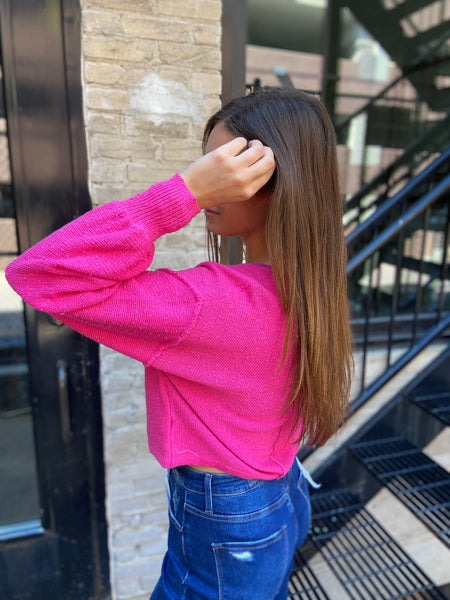 Side view of fuchsia textured sweater