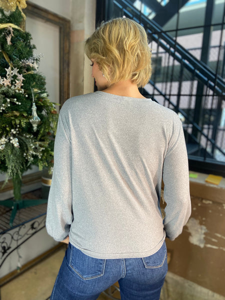 Back view of a Heather gray colored hacci knit long sleeve top