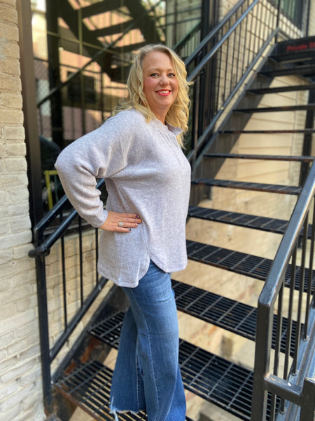 Side view of a Zenana Brand heather Gray brushed knit oversized henley top 