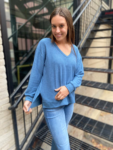 Blue deep v neck long sleeve top with side slits