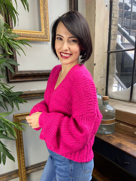 Side view of fuchsia cardigan sweater