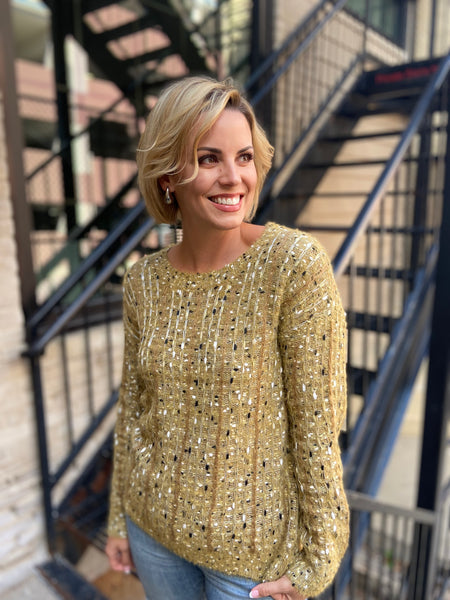 front view of a textured mustard sweater