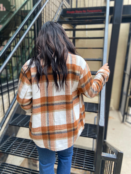 Back view of a rust & ivory plaid shacket