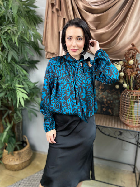 Teal and black abstract print blouse with neck tie