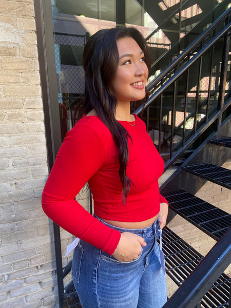 Side View of a Red  ribbed fitted cropped top