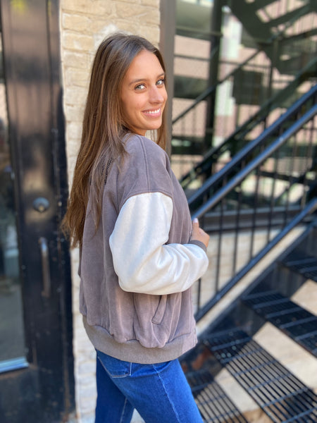 Side view of a color block letterman style jacket