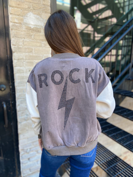 Back View of a letterman style jacket with "ROCK" and a lightning bolt in studs