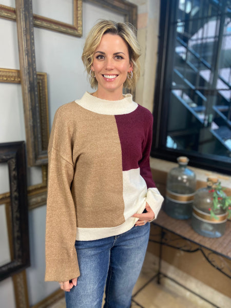 A brown, burgundy and ivory color block sweater from Blu Pepper