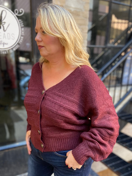 Side view of a Burgundy plus size cardigan sweater 