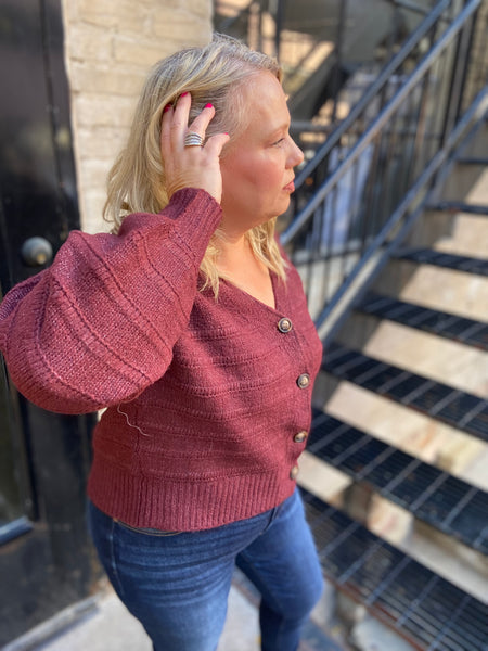 Side view of a Burgundy plus size cardigan sweater 