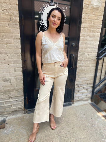 wide leg jeans cream jeans paired with lace top cropped solid beige jeans 