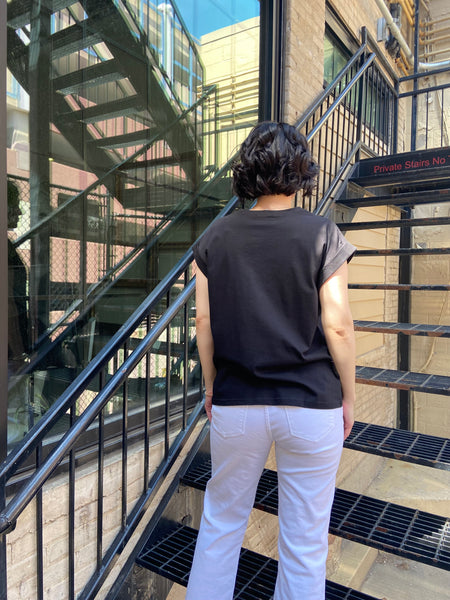 Introducing the Alex Black Folded Short Sleeve Tee – your go-to casual piece that effortlessly merges comfort with style. With its round neck and chic folded short sleeves, this basic tee is perfect for any occasion, from coffee dates to weekend outings.

- Crafted from 100% cotton for ultimate comfort
- Relaxed drop shoulder design for a trendy fit
- Available in sizes Small, Medium, and Large
- Easy care: hand wash cold, line dry
 