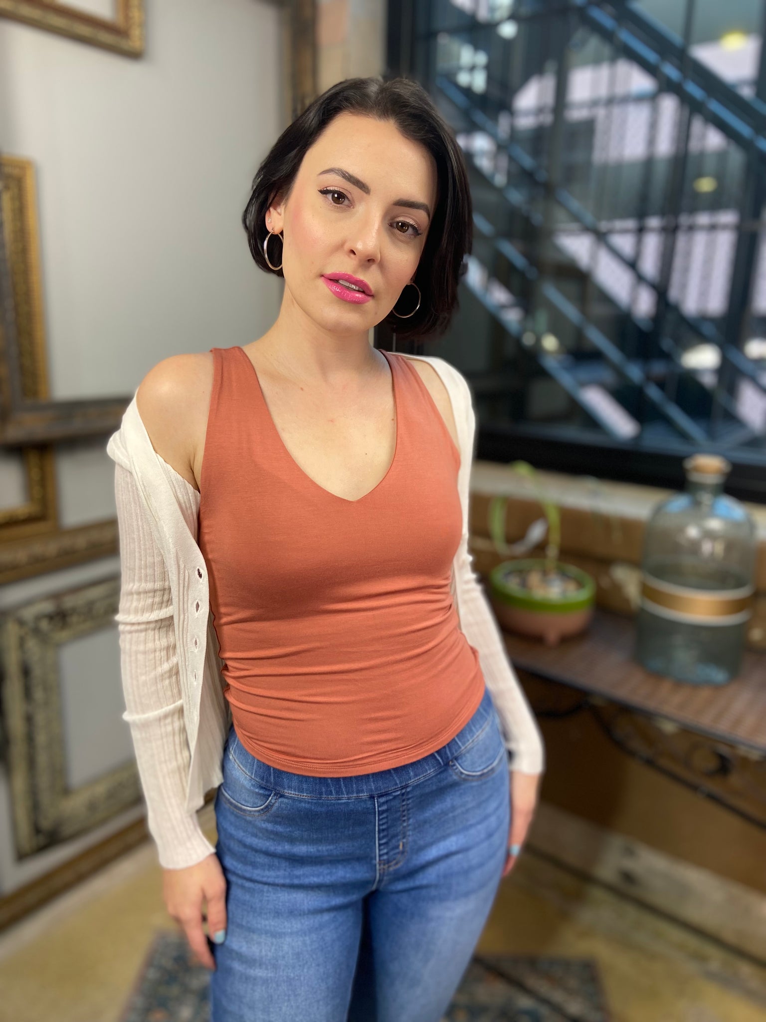 ashley terra cotta v neck soft stretchable tank top paired with blue jeans