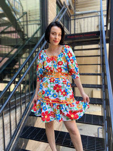 The Bea Multicolor Floral Mini Dress is a playful and vibrant addition to any wardrobe. With a floral scoop neck and unique piping details, this dress is anything but ordinary. Let the vibrant floral pattern speak for itself as you make a statement with this quirky and fun dress.