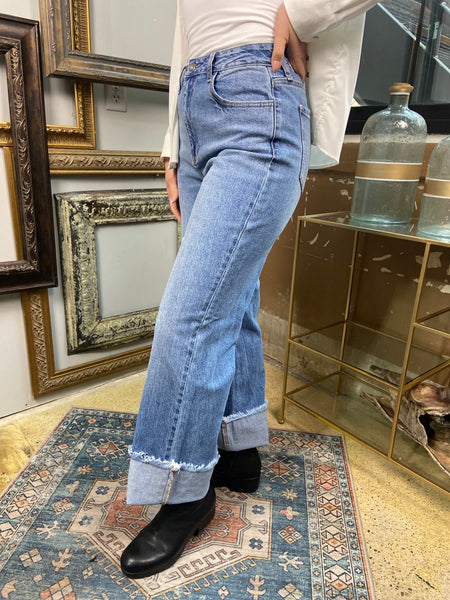 jelly jeans high waisted long raw hem straight wide leg jeans solid medium to light wash denim paired with white button up