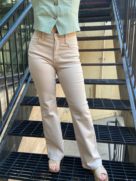 emeric high rise cream flared wide leg jeans paired with mint green linen blazer vest